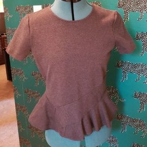 Grey peplum top by J. Crew.
